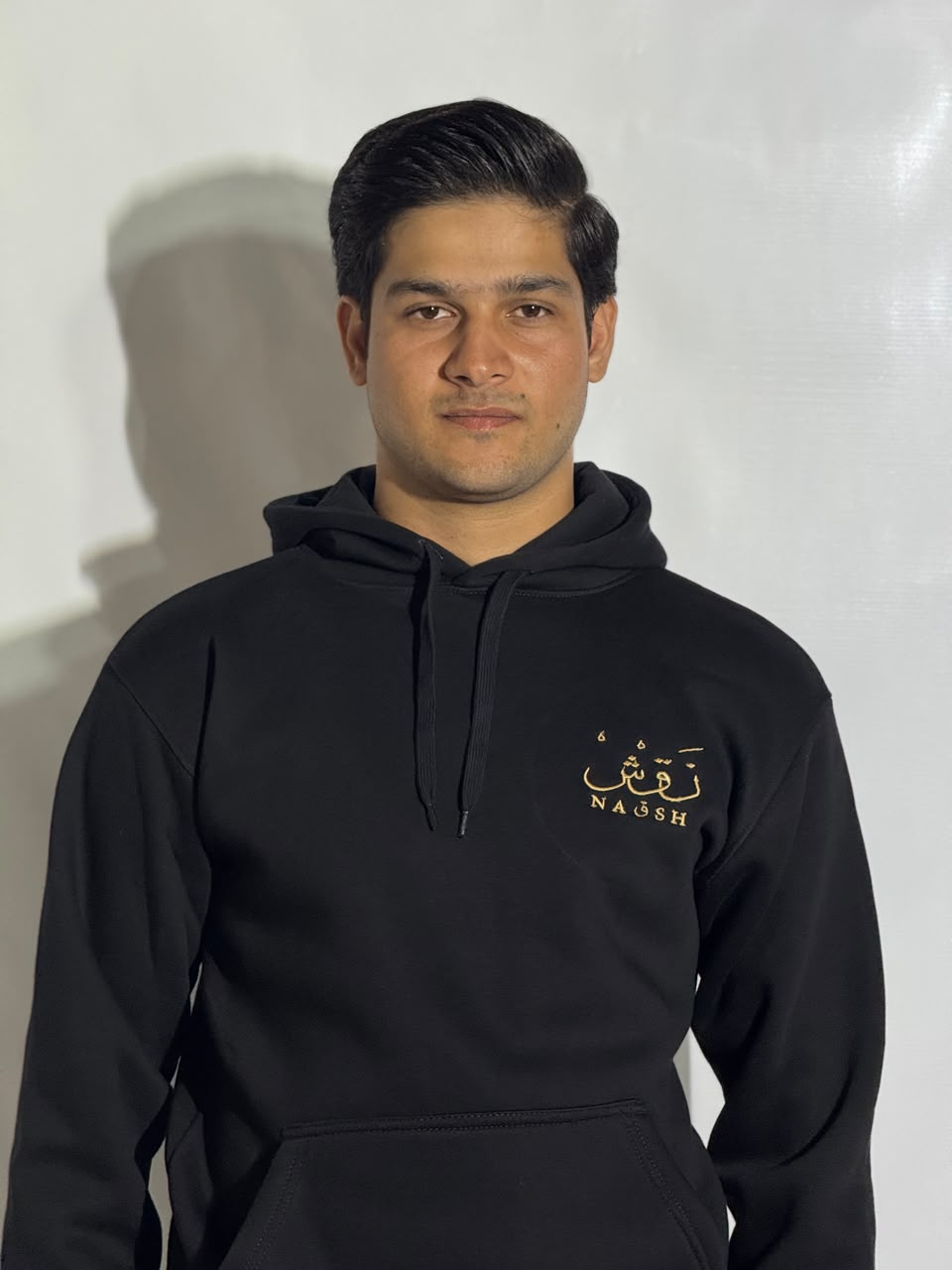 Naqsh Black Embroidered Hoodie for Men – Premium Fleece Pullover with Golden Urdu Calligraphy Logo & Kangaroo Pocket