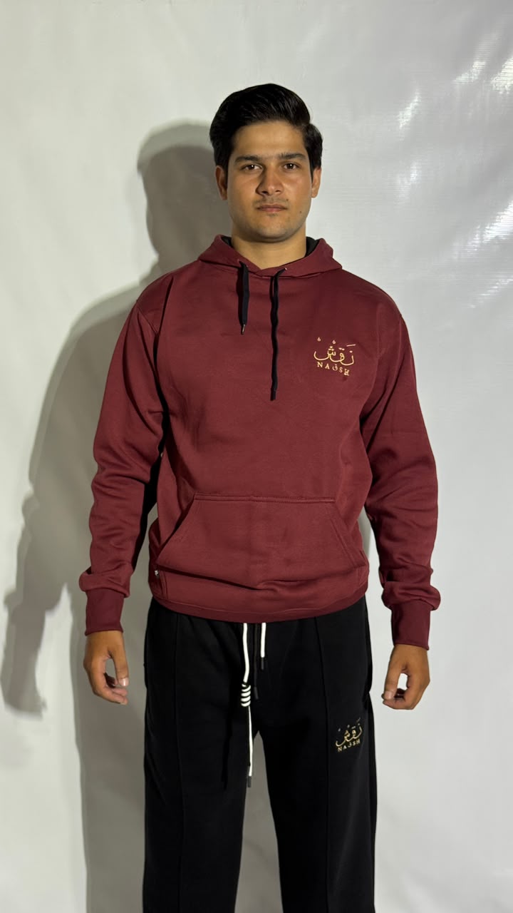 Naqsh Maroon Embroidered Hoodie for Men – Premium Fleece Pullover with Golden Urdu Calligraphy Logo & Kangaroo Pocket